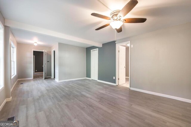 spare room with ceiling fan and hardwood / wood-style floors