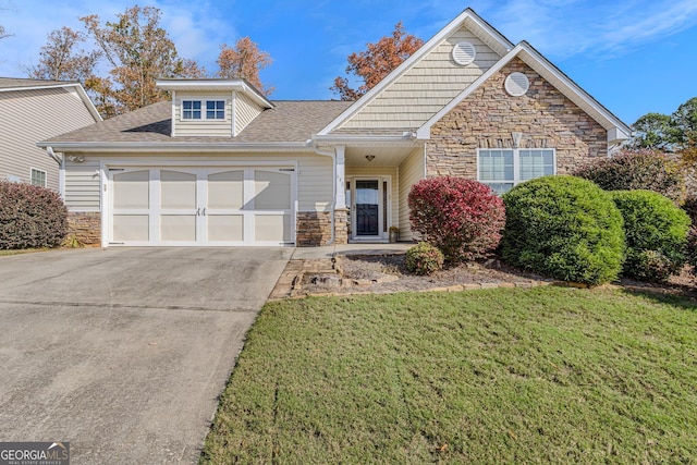 front facade featuring a garage and a front yard