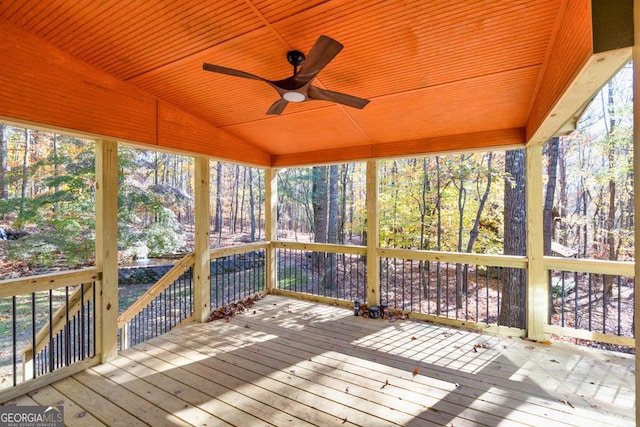 wooden deck featuring ceiling fan