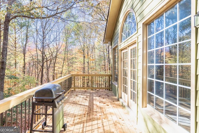 wooden terrace with area for grilling