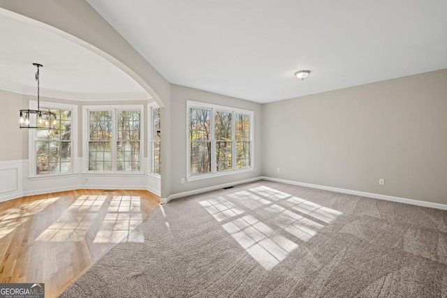 interior space featuring a chandelier and light hardwood / wood-style flooring