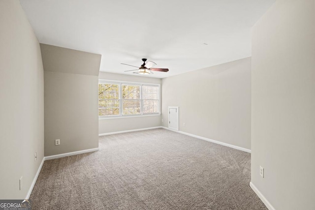 spare room with carpet flooring and ceiling fan