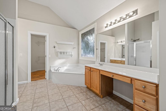 bathroom featuring tile patterned floors, vaulted ceiling, and shower with separate bathtub