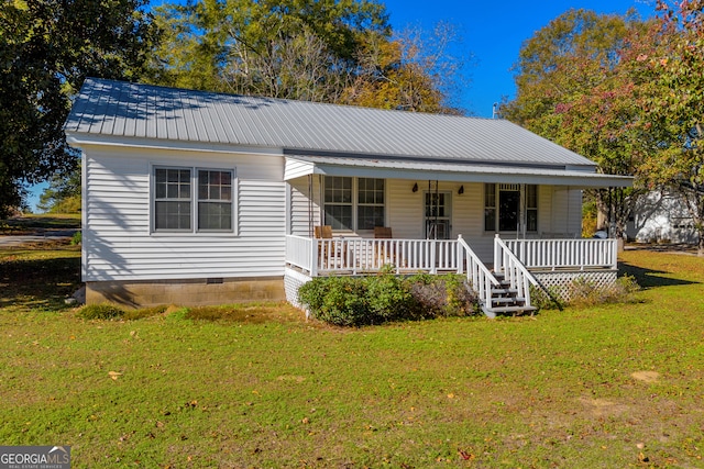 view of front of home with a porch and a front yard