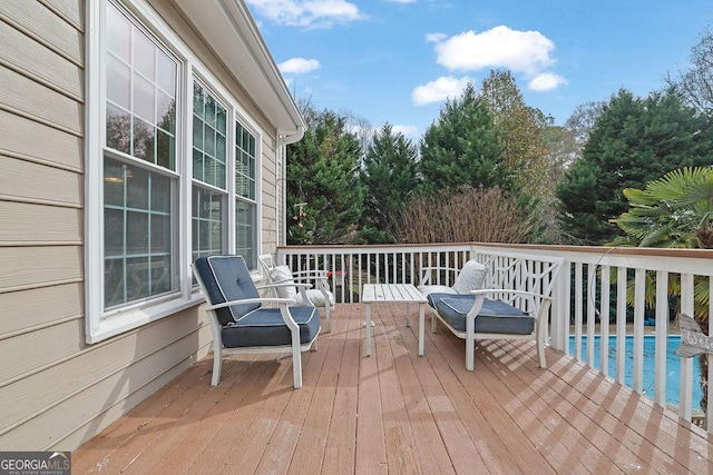 deck with an outdoor pool