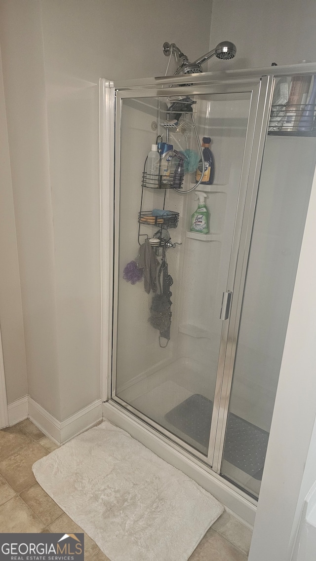 bathroom featuring tile patterned floors and walk in shower