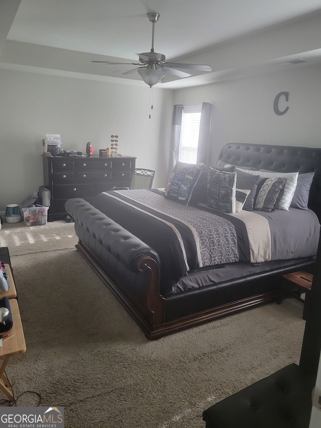 bedroom featuring ceiling fan and carpet floors