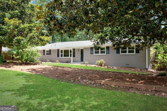 ranch-style house with a front lawn