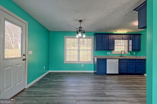 kitchen with blue cabinets, dishwasher, a sink, baseboards, and a textured ceiling
