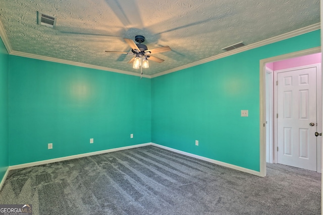 carpeted empty room featuring a textured ceiling, visible vents, a ceiling fan, and baseboards