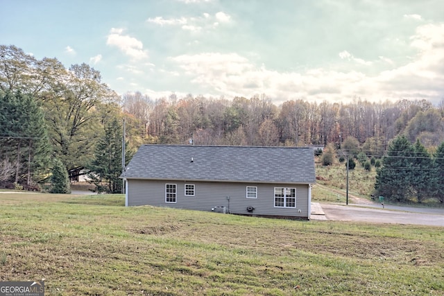 back of property with a yard