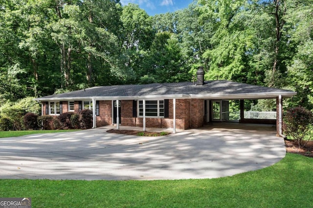 single story home featuring a front yard and a carport