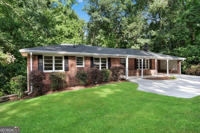 single story home with a front yard and a patio