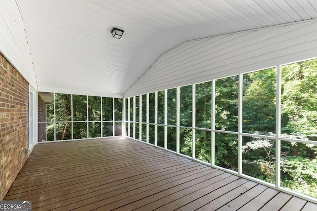 unfurnished sunroom with wood ceiling and vaulted ceiling