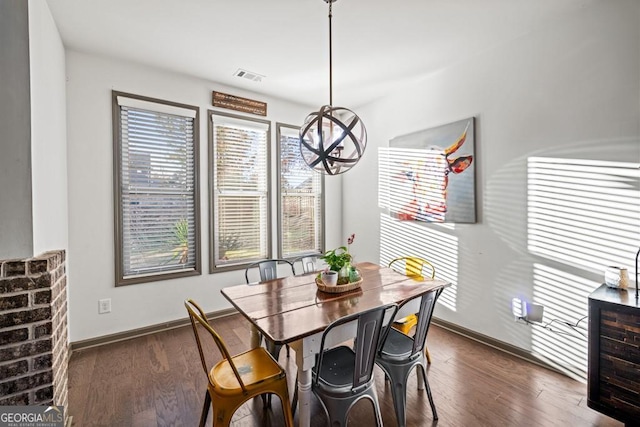 dining area featuring dark hardwood / wood-style flooring