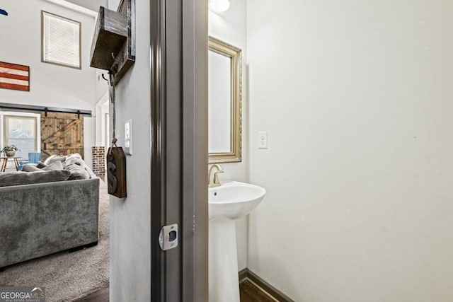 bathroom with hardwood / wood-style floors