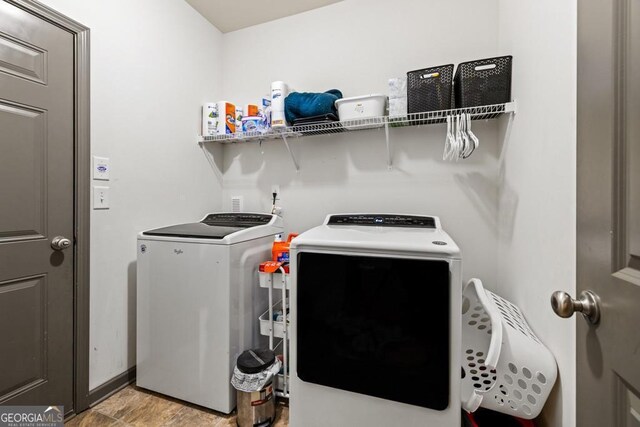 laundry area with washing machine and dryer