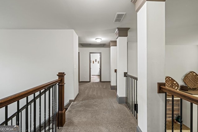 hallway with dark colored carpet