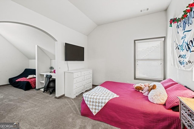 carpeted bedroom featuring vaulted ceiling