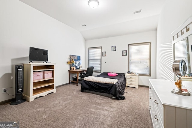 bedroom with light carpet and vaulted ceiling