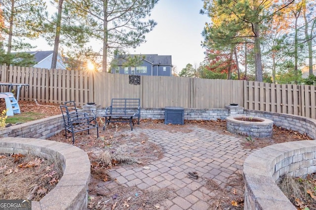 view of patio / terrace featuring an outdoor fire pit