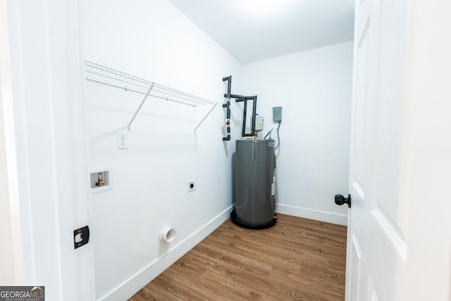 laundry area with washer hookup, electric dryer hookup, wood finished floors, laundry area, and baseboards