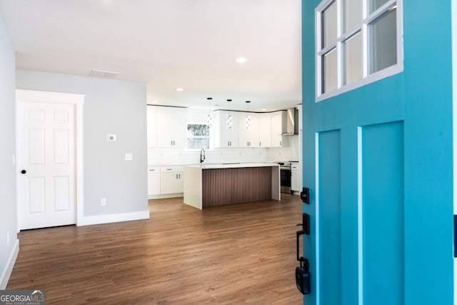 interior space with recessed lighting, dark wood finished floors, visible vents, and baseboards