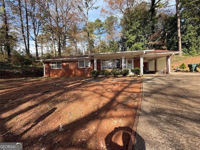 ranch-style house with a carport