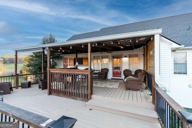 wooden deck with an outdoor hangout area