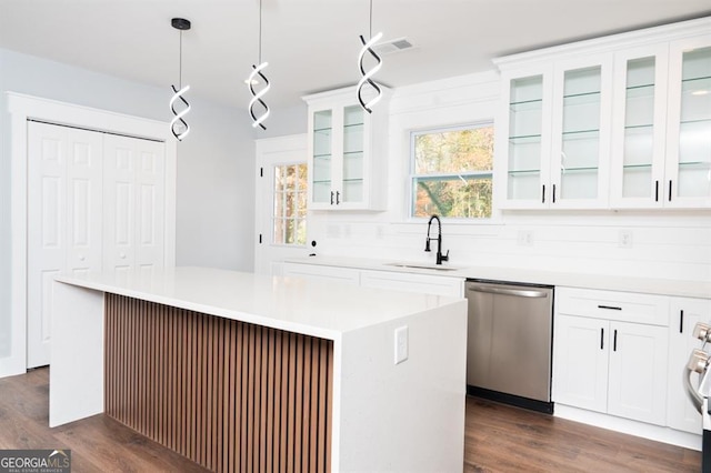 kitchen featuring white cabinets, sink, pendant lighting, dishwasher, and a center island