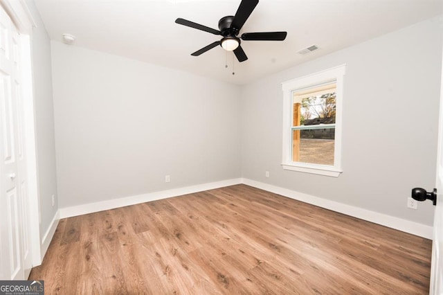 unfurnished room with ceiling fan and light hardwood / wood-style flooring