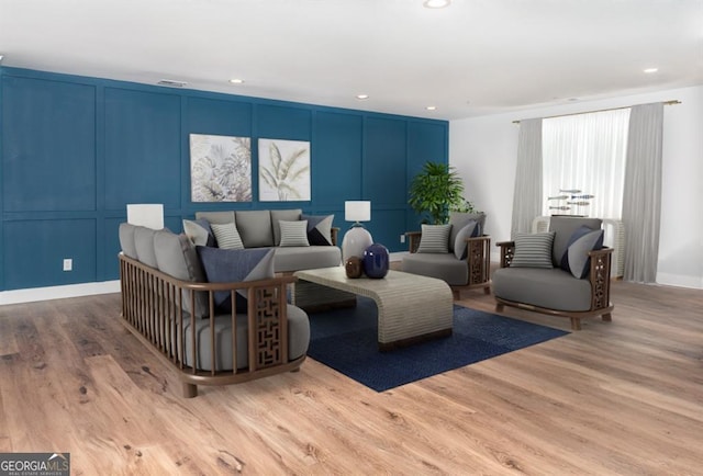 living room with light hardwood / wood-style flooring