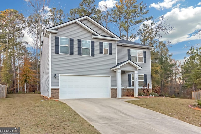 view of front facade featuring a front yard and a garage