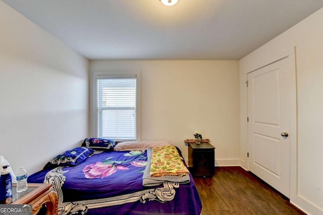 bedroom featuring dark hardwood / wood-style flooring