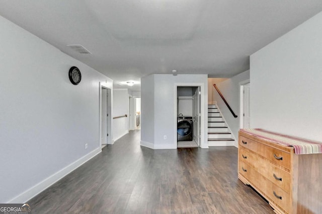 unfurnished living room featuring dark hardwood / wood-style floors