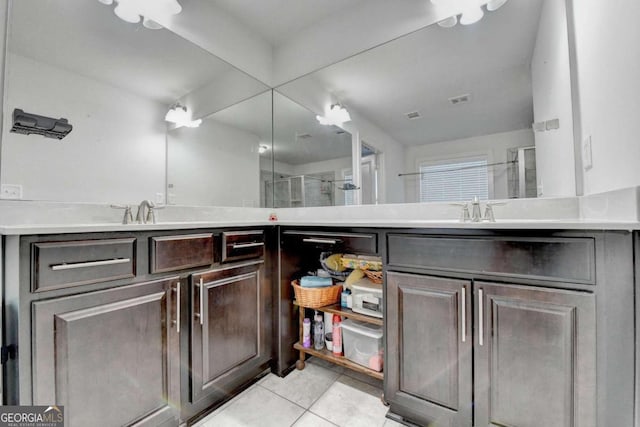 bathroom featuring vanity, tile patterned floors, and an enclosed shower