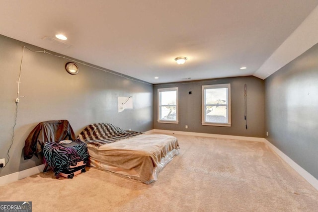 bedroom featuring carpet flooring and lofted ceiling