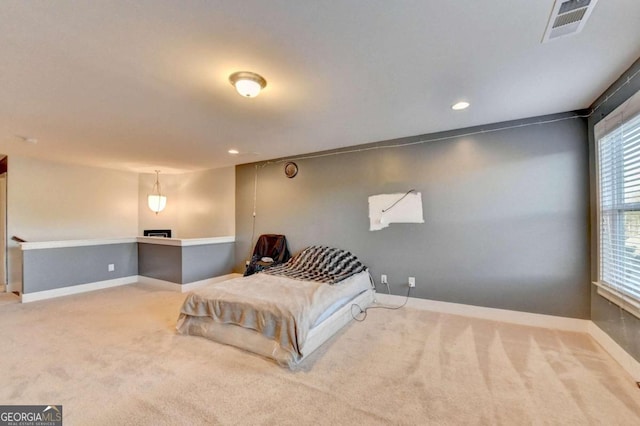 bedroom featuring light colored carpet