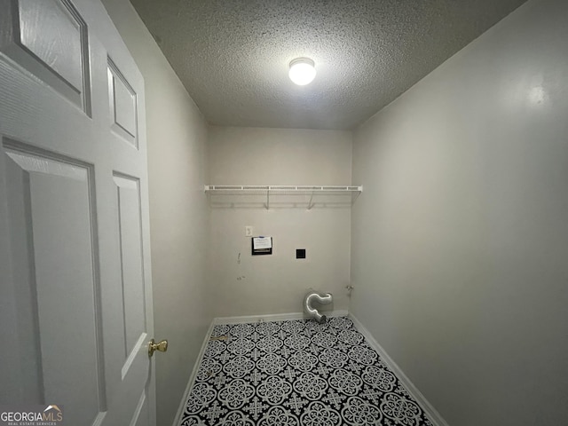 1529 Evergreen Hollow Ln, Conyers, GA 30012 - laundry area with hookup for a washing machine, baseboards, and a textured ceiling