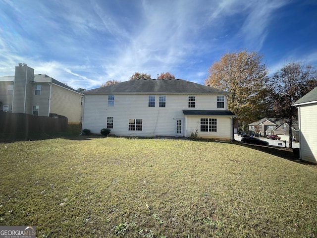 1529 Evergreen Hollow Ln, Conyers, GA 30012 - rear view of property featuring a lawn
