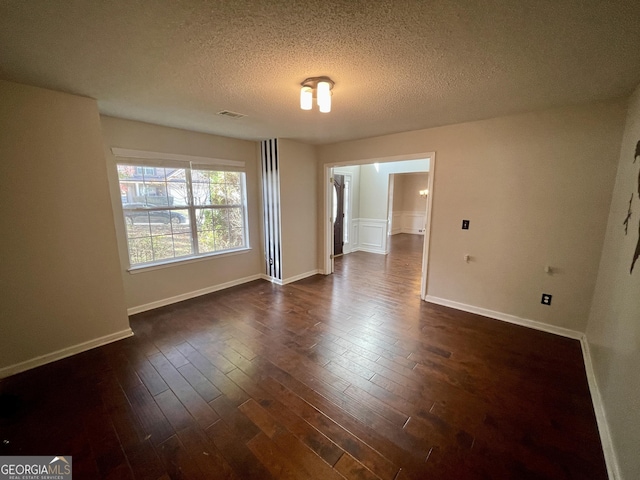 1529 Evergreen Hollow Ln, Conyers, GA 30012 - unfurnished room with a textured ceiling, dark wood-style floors, and baseboards