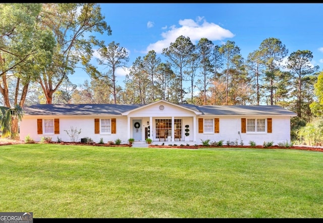 single story home with covered porch and a front lawn