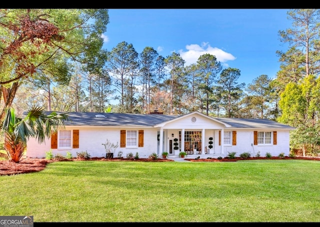 single story home with a front yard and a porch