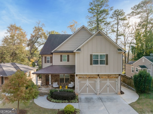 view of front of house featuring a porch and a garage