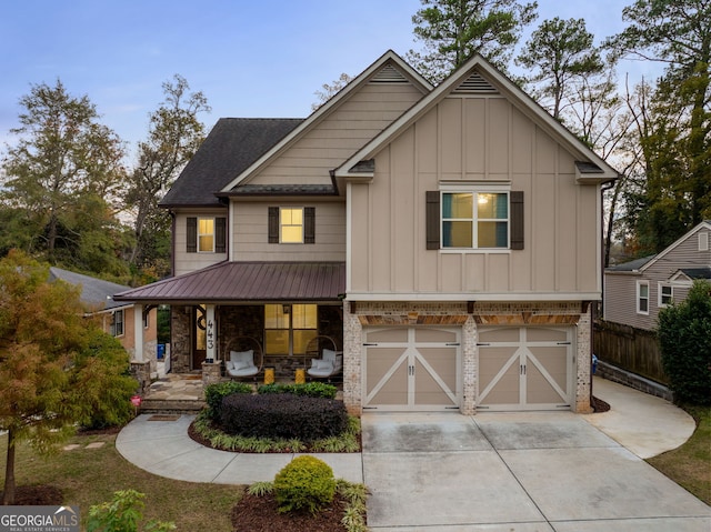 view of front of property with a porch and a garage