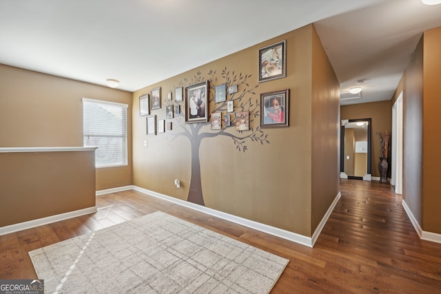 hallway with wood-type flooring