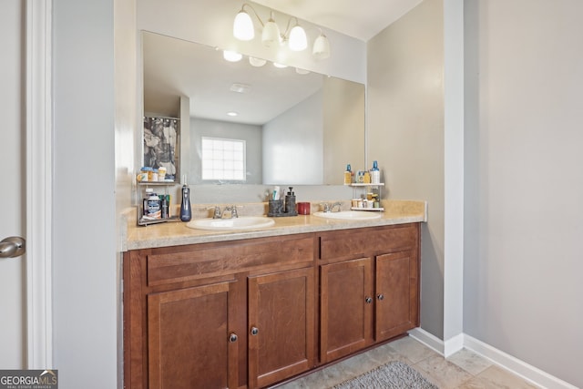 bathroom with tile patterned flooring and vanity