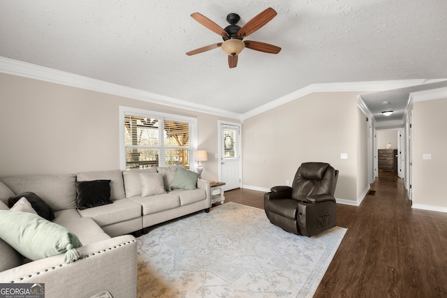 living room with ornamental molding, dark hardwood / wood-style floors, ceiling fan, and lofted ceiling