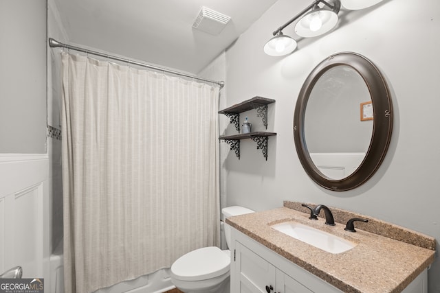 full bathroom with shower / bathtub combination with curtain, vanity, and toilet