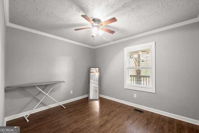 unfurnished bedroom featuring ceiling fan, dark hardwood / wood-style floors, crown molding, and a textured ceiling